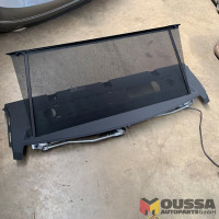 Parcel shelf with rolling blind