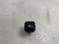 Pushbutton for tank flap