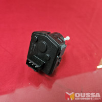 Headlight servomotor adjuster