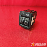 Headlight range adjuster switch