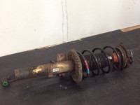 Shock absorber with wheel bearing housing