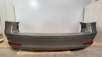 Rear bumper cover with reflectors